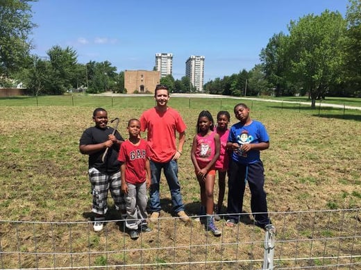 Kevin, Lewis, China, Nicole, and Arzell during an impromptu outdoor classroom session covering urban agriculture, environmental awareness, and healthy nutrition.
