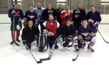 Doug and his hockey team pose for a team picture