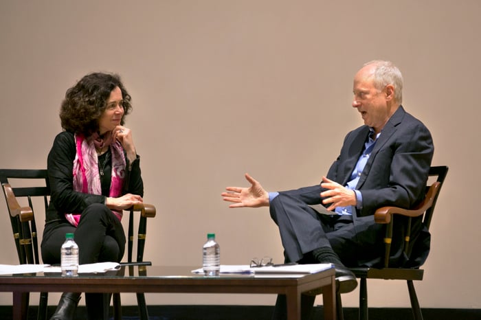 Harvard Professors Rebecca Henderson and Michael Sandel sit on stage discussing the future of capitalism at HBX ConneXt
